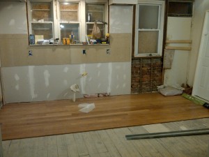 The subfloor needed repair before I lay down the bamboo floor. I also finished the exterior wall with insulation. I was tempted to leave the brick finish, but the wall was ice cold and I would sacrifice a great deal of cabinet space.