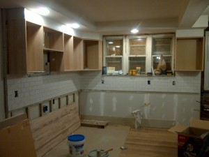 The subway tiles are in and the cabinets were delivered.