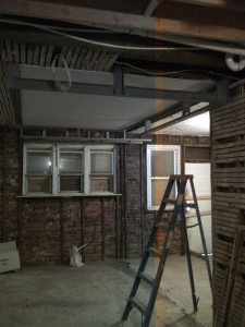 At this point, the majority of plumbing drain pipes are in place. I chose to start on the non-structural steel soffits, in the kitchen area and gain a better perspective of what space I have to work with.
